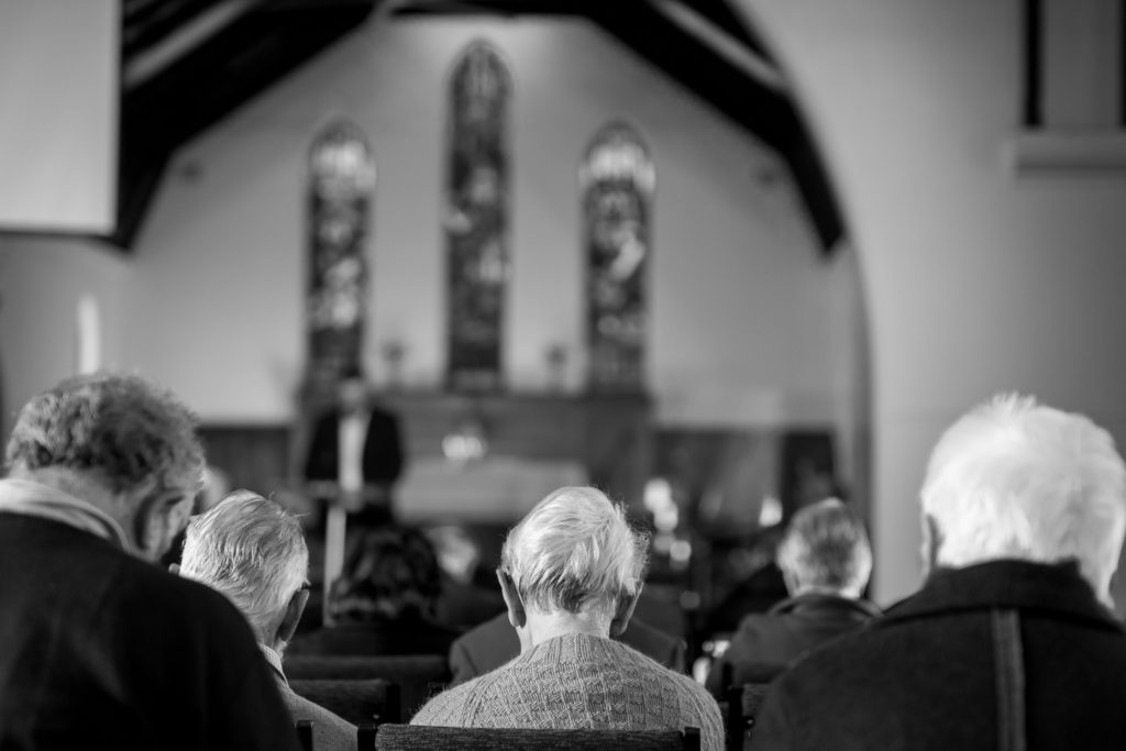 8am people praying in church