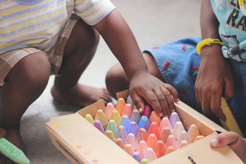 playtime child playing with chalk